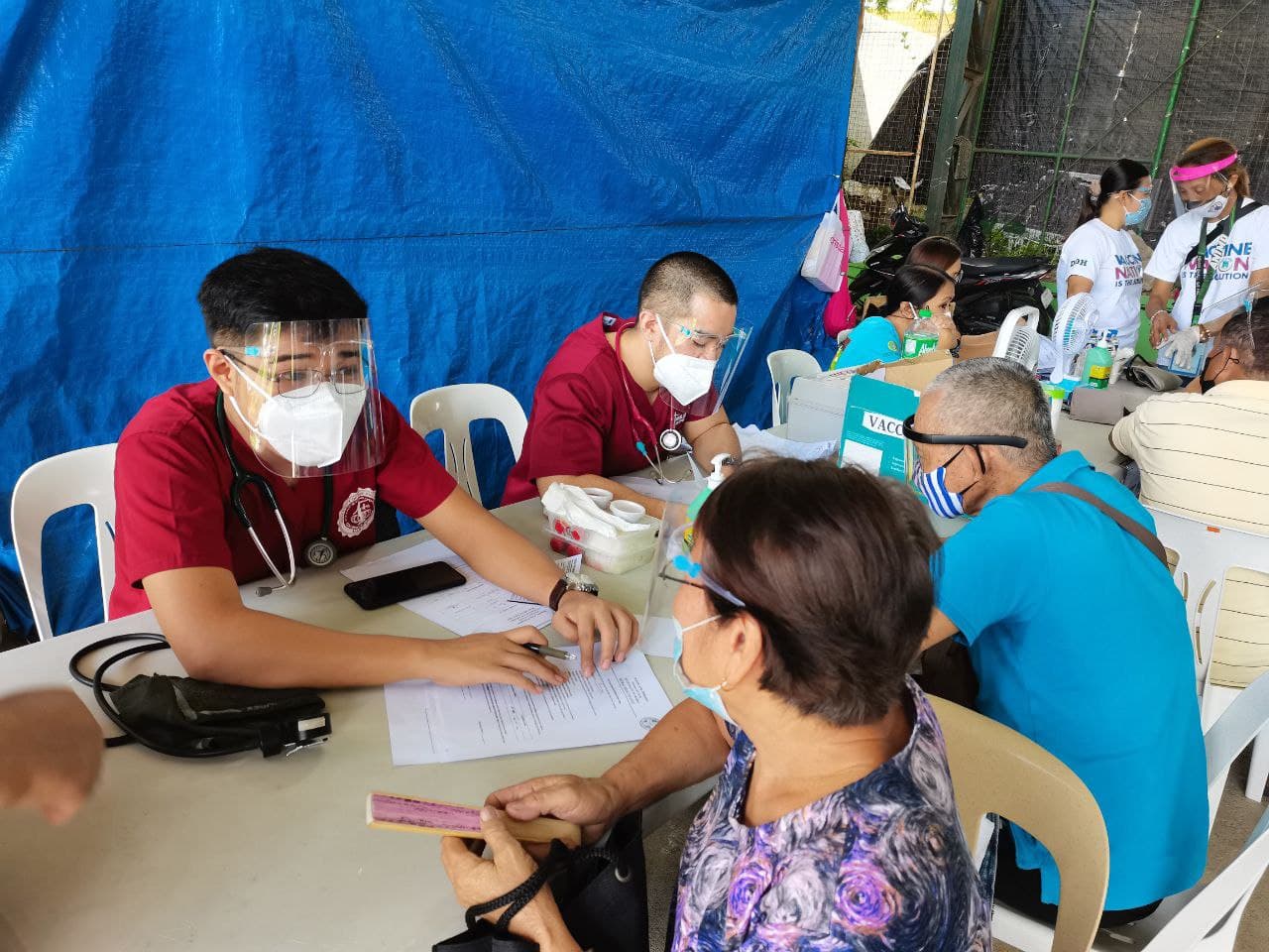 (Then UPCM-PGH 2021 interns) Drs. Kurt Baladjay and Miguel Arkoncel at work during the Resbakuna (COVID-19 vaccination) operations in the Town of Amadeo, Cavite